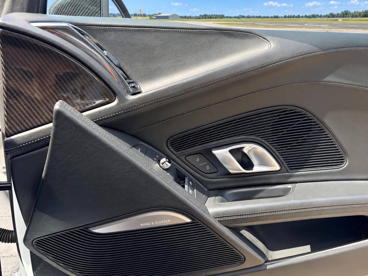 Bang and Olufsen speaker detail inside the Audi R8 Spyder Cambridge hire car