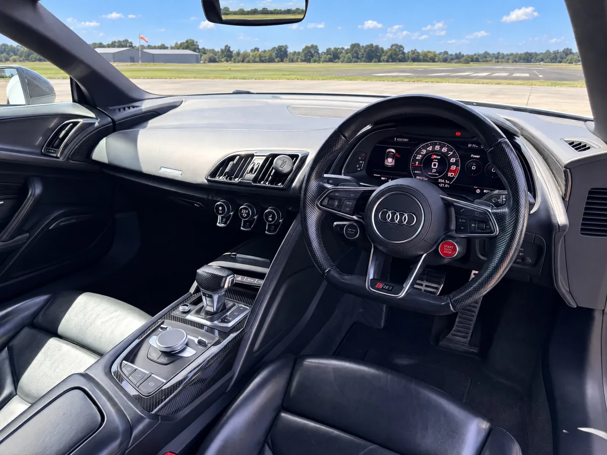 Driver's view of the Audi R8 Spyder cockpit with virtual cockpit rev counter