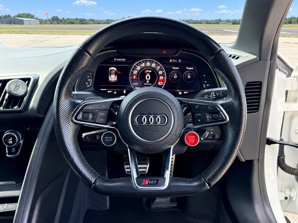 Audi R8 Spyder steering wheel with the engine start button and virtual cockpit