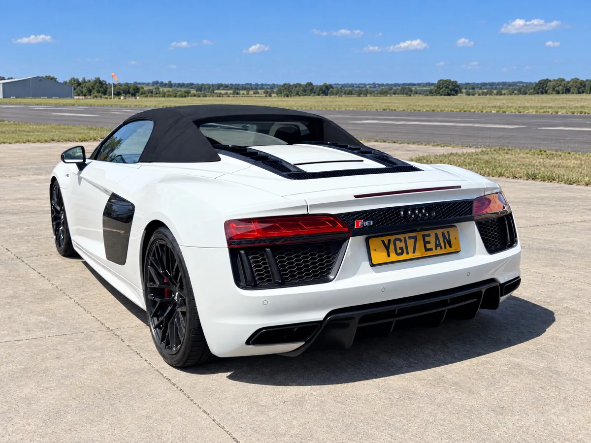 Rear of the white Audi R8 Spyder Suffolk hire car with the roof up